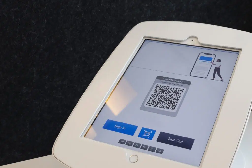 A white tablet featuring a QR code for contactless solutions.