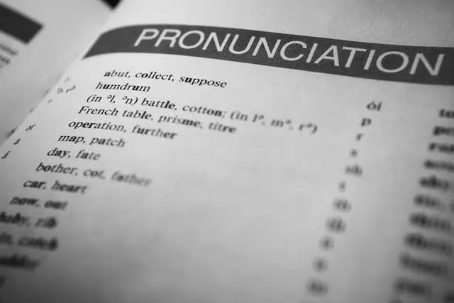 A black and white photo of a book featuring the word pronunciation for language learning.
